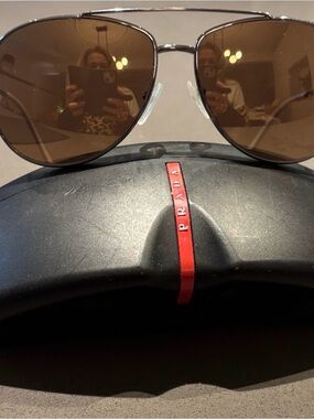 Prada Silver Frame Sunglasses with Brown Lenses